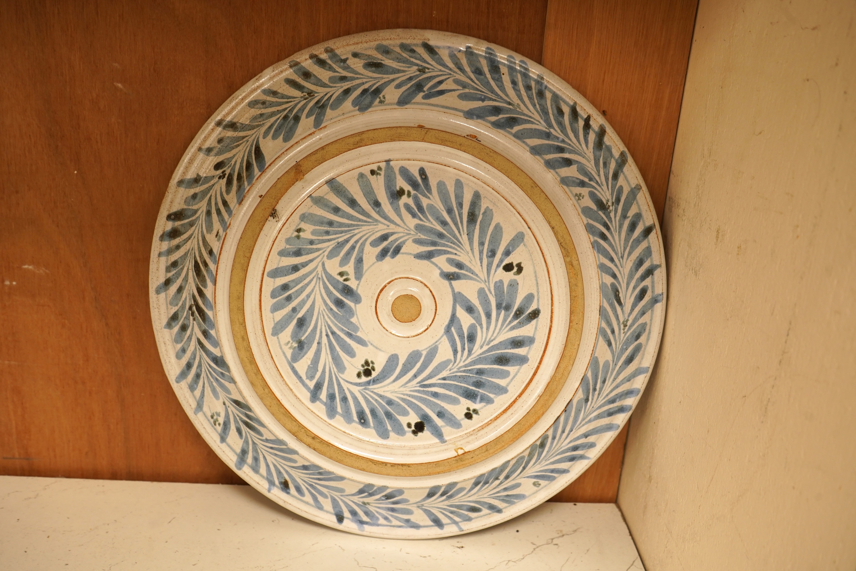 A mixed collection of European studio pottery to include a collection of four tall Italian candlesticks, tallest 58cm, two stoneware plates and a tureen and cover, etc.